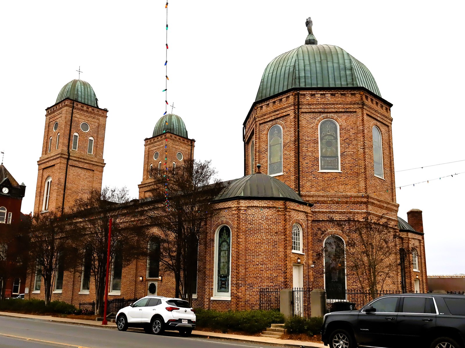 The red brick Basilica of the Immaculate Conception, with its green domes, in downtown Natchitoches